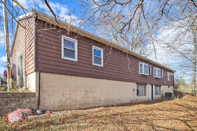 view of property exterior with central AC unit