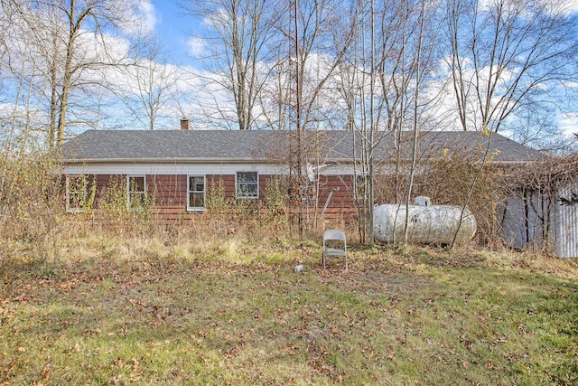 view of side of property featuring a yard