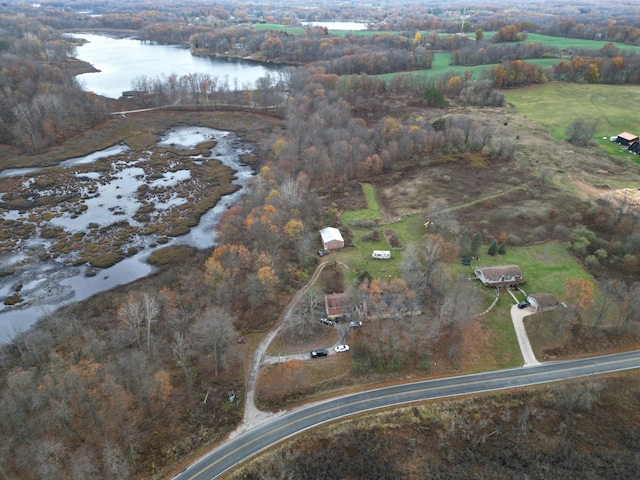 birds eye view of property featuring a water view