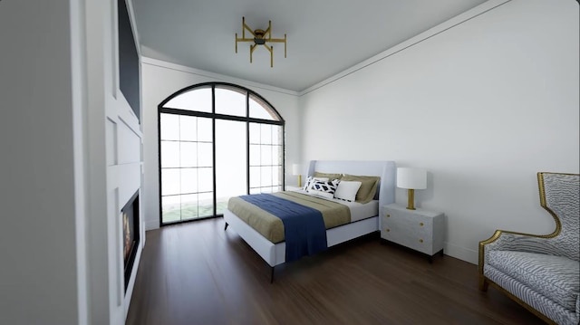 bedroom featuring dark hardwood / wood-style flooring and crown molding