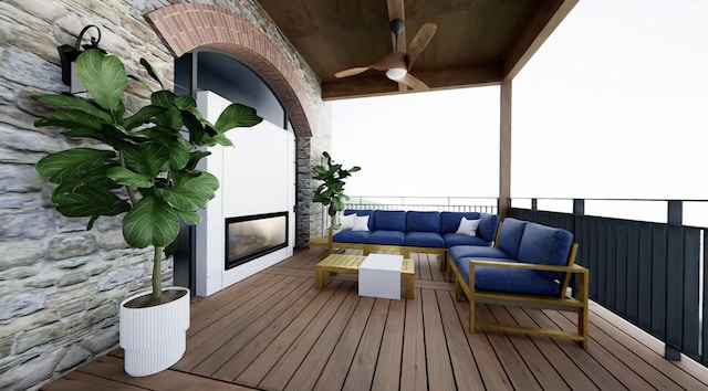 wooden deck with an outdoor living space with a fireplace and ceiling fan