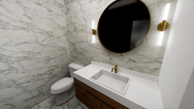 bathroom with vanity, toilet, and tile walls