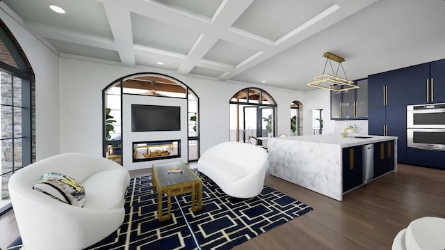 living room with coffered ceiling, dark wood-type flooring, sink, beam ceiling, and a fireplace