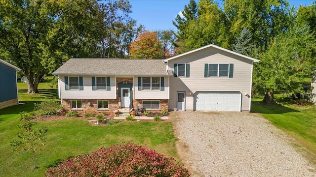 view of front of home featuring a front yard and a garage