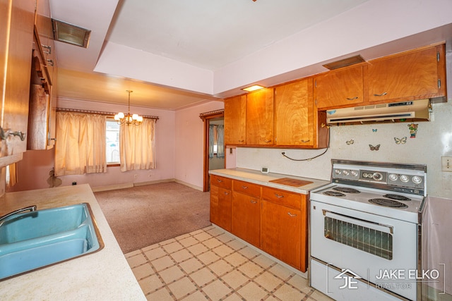 kitchen with white range with electric stovetop, sink, hanging light fixtures, light colored carpet, and a notable chandelier