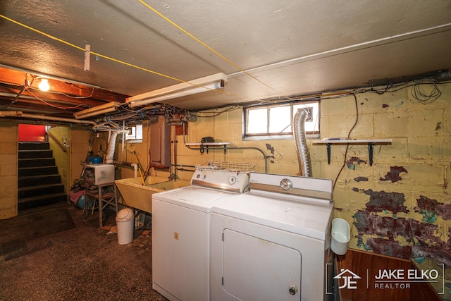 laundry room featuring separate washer and dryer and sink