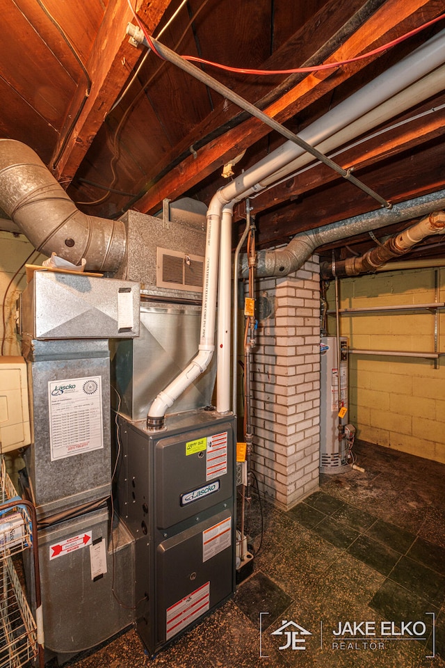 utility room featuring gas water heater