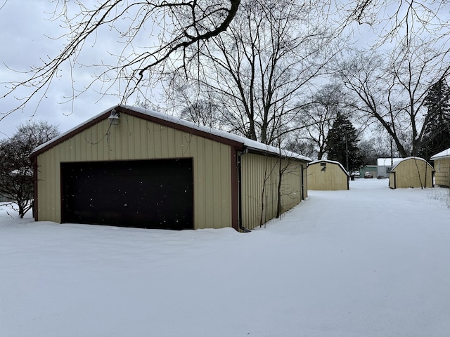 view of snow covered garage