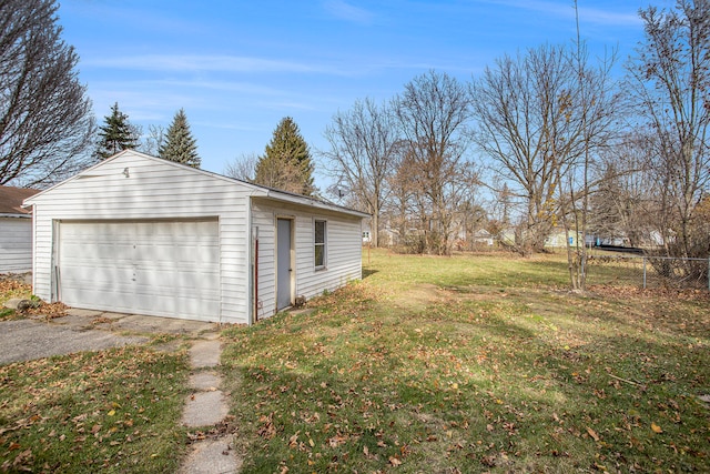 garage with a lawn