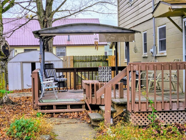 wooden deck featuring a shed