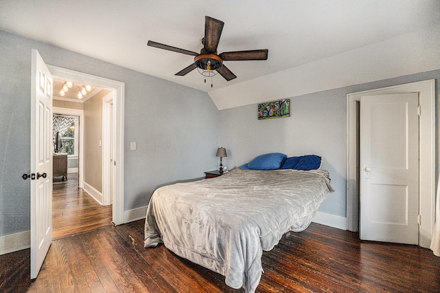 bedroom featuring dark hardwood / wood-style floors, ceiling fan, and lofted ceiling