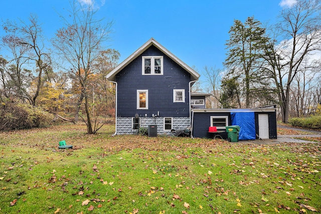 back of house with a yard