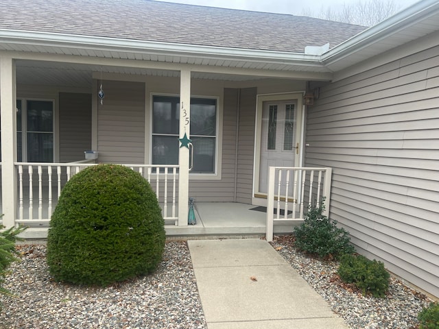 doorway to property featuring covered porch