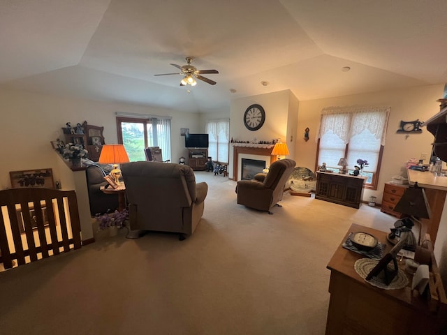 carpeted living room featuring ceiling fan