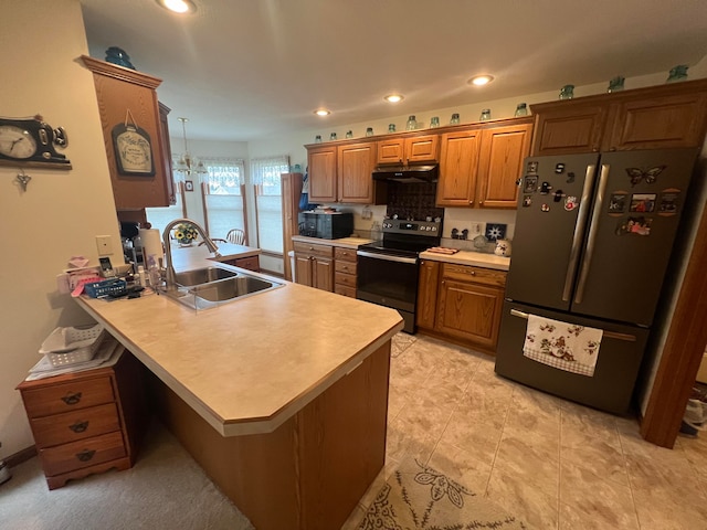 kitchen with backsplash, black appliances, sink, kitchen peninsula, and a chandelier