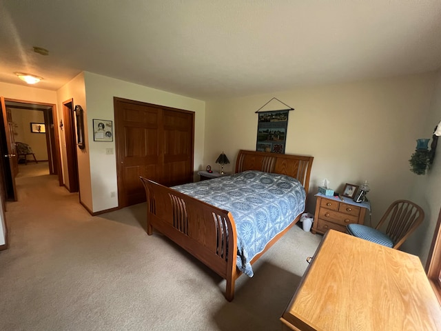 carpeted bedroom featuring a closet