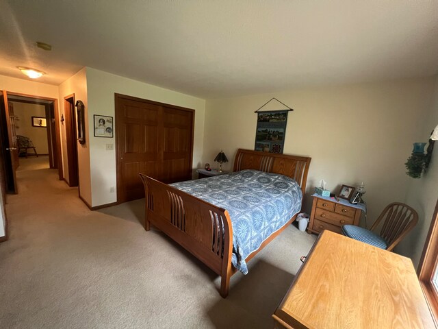 carpeted bedroom with a closet