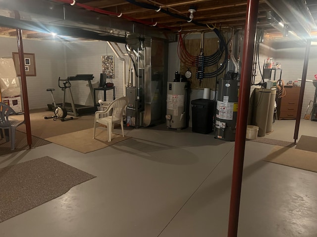 basement featuring heating unit and gas water heater