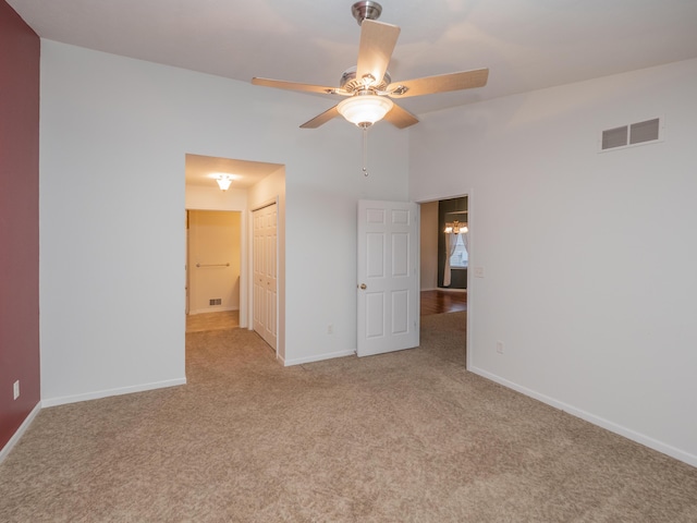 carpeted empty room with ceiling fan