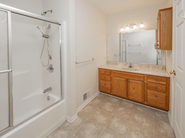 bathroom featuring shower / bath combination with glass door, vanity, and tile patterned floors