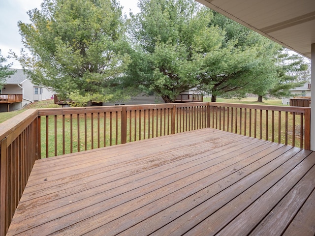 wooden terrace with a yard