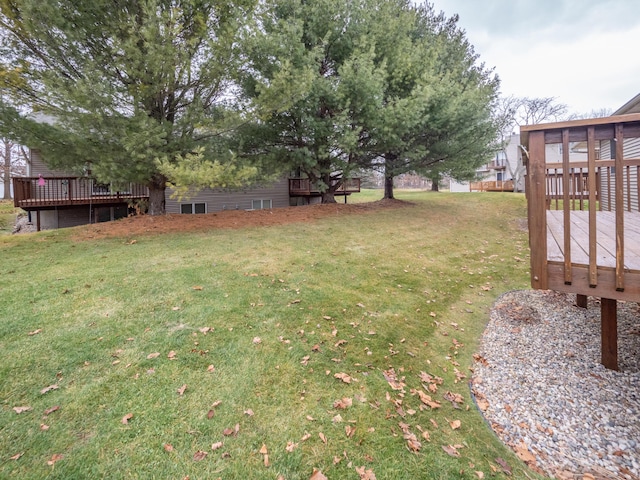 view of yard featuring a wooden deck