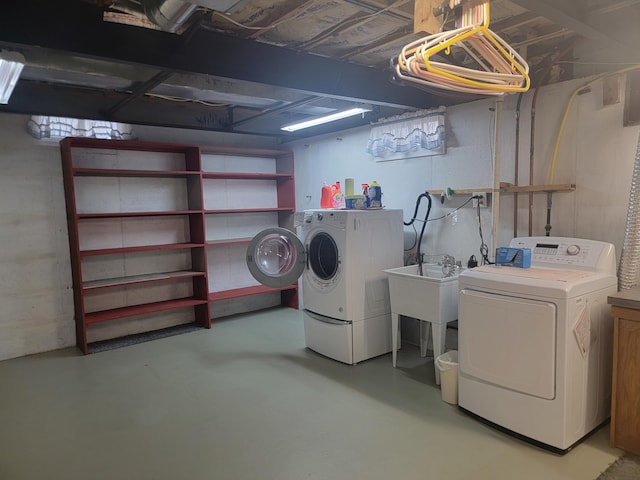 laundry area featuring separate washer and dryer and sink