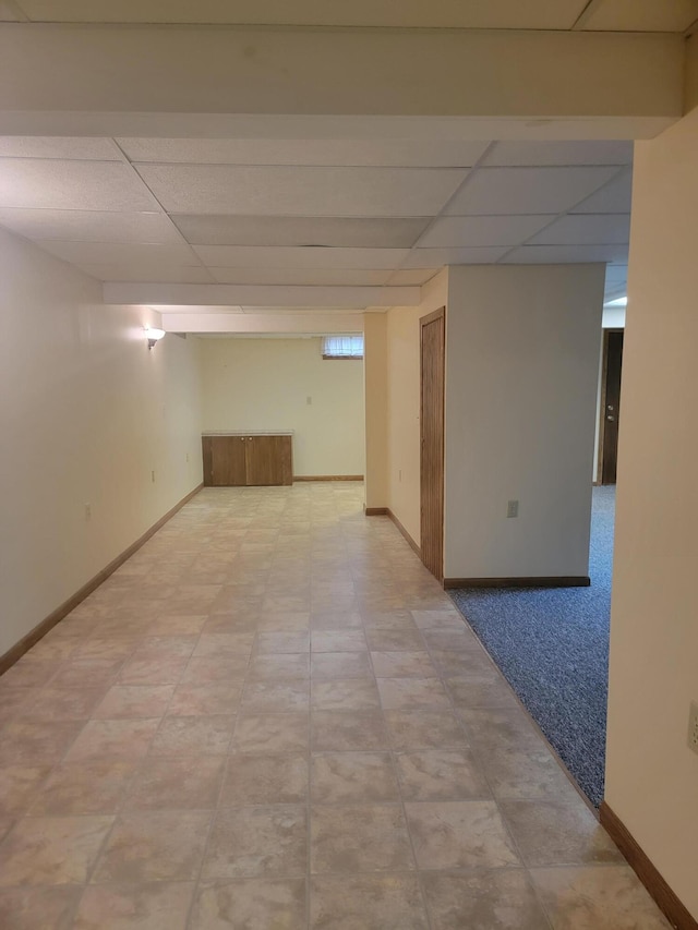 unfurnished room featuring a paneled ceiling