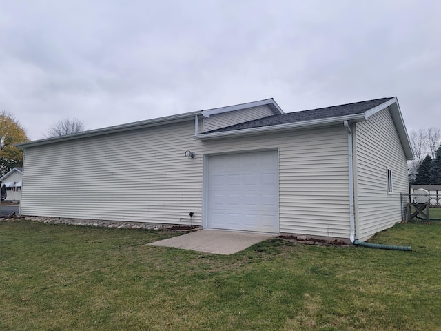 garage featuring a lawn