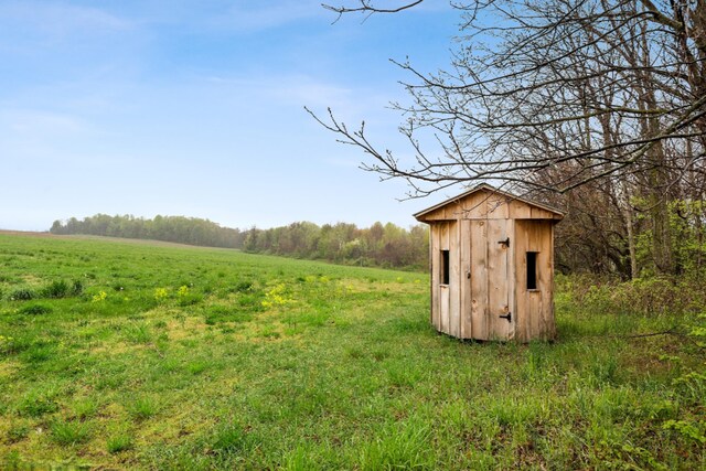 view of outdoor structure featuring a rural view