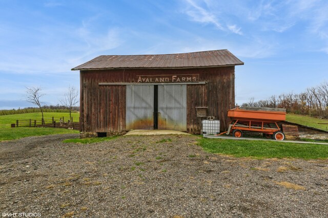 view of outdoor structure featuring a rural view