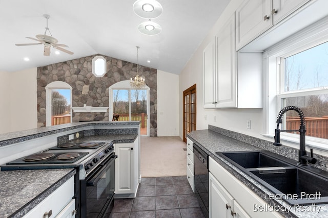 kitchen featuring black appliances, white cabinets, lofted ceiling, and sink