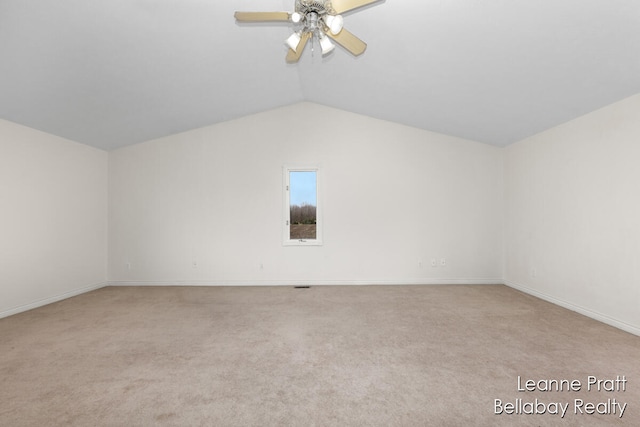 bonus room featuring light colored carpet, vaulted ceiling, and ceiling fan