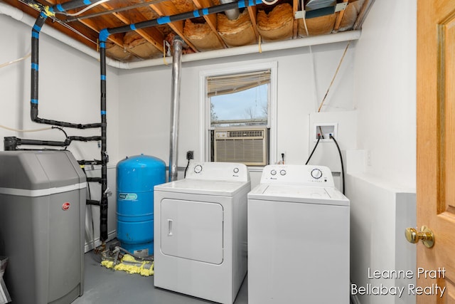 laundry area with cooling unit and independent washer and dryer