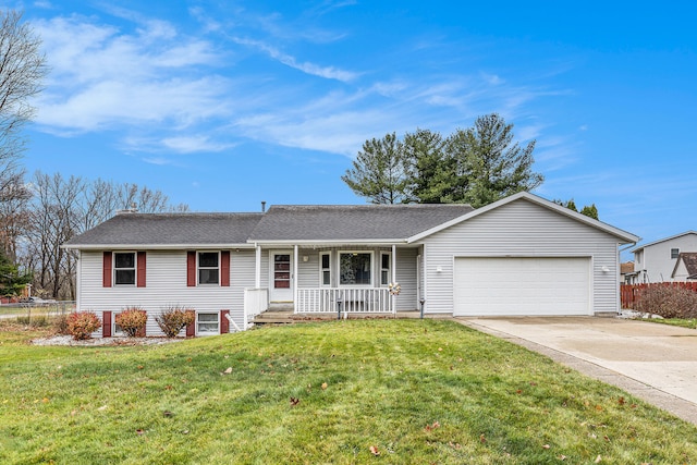 ranch-style house with covered porch, a garage, and a front lawn