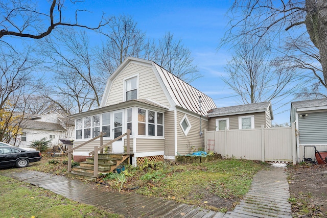 view of front of home with a sunroom