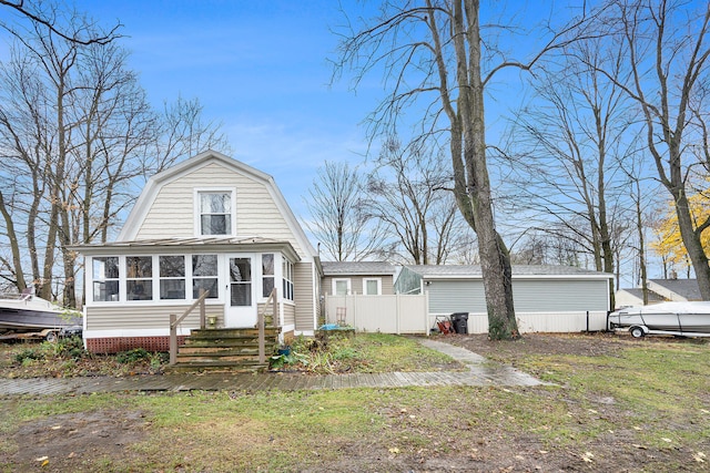 view of front of home featuring a sunroom