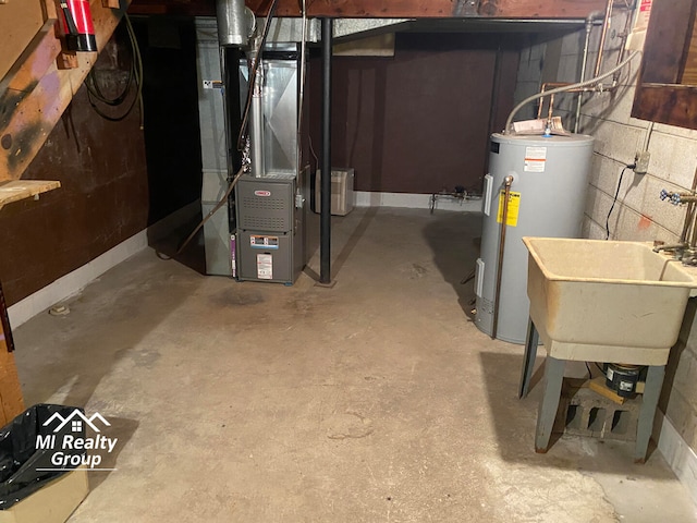 utility room featuring electric water heater, sink, and heating unit