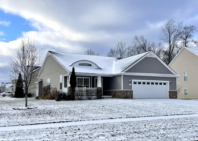 view of front of home with a porch and a garage