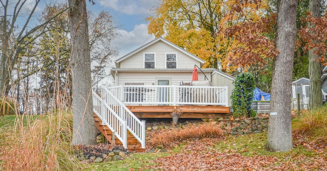 back of property featuring a deck