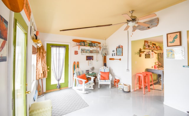 interior space featuring ceiling fan and a wealth of natural light