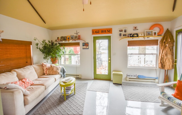 living room with concrete floors and a baseboard radiator