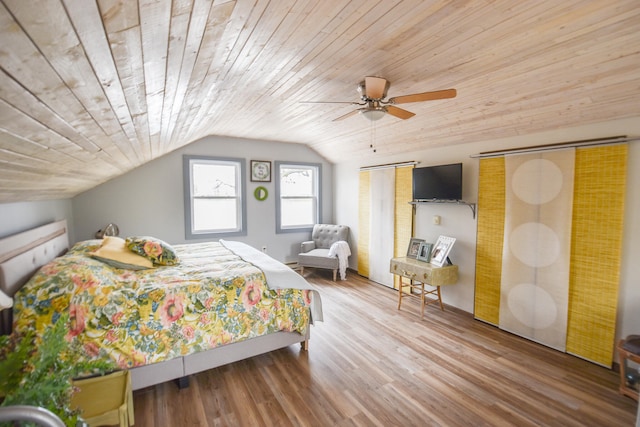 bedroom featuring wooden ceiling, hardwood / wood-style flooring, ceiling fan, and lofted ceiling