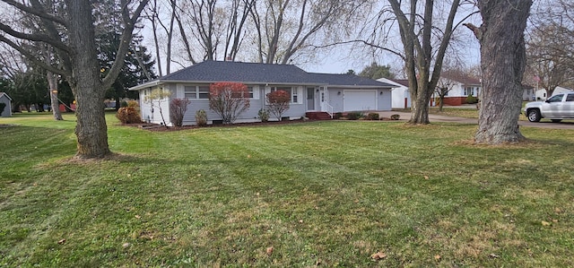 single story home featuring a garage and a front yard