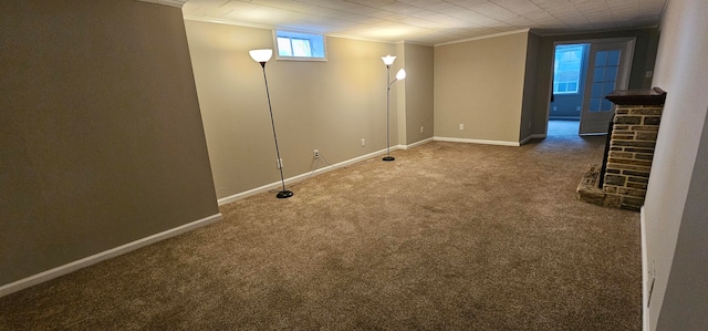 basement featuring carpet flooring and ornamental molding