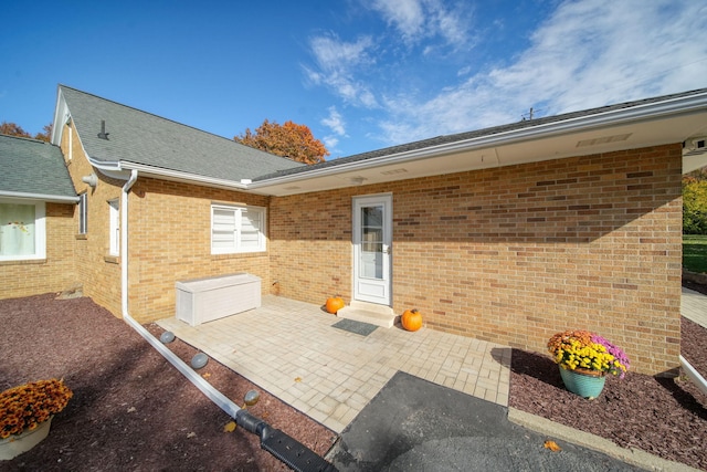 back of property with a patio area