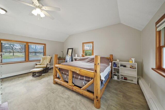 bedroom featuring baseboard heating, multiple windows, ceiling fan, and vaulted ceiling