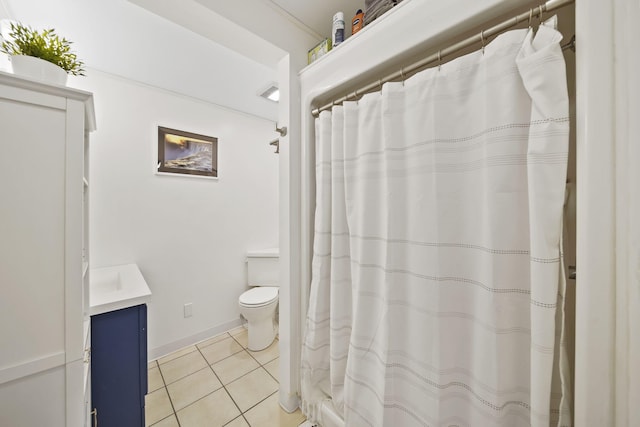 bathroom featuring toilet, vanity, and tile patterned floors