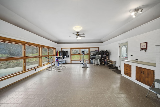 workout area with a wealth of natural light and ceiling fan