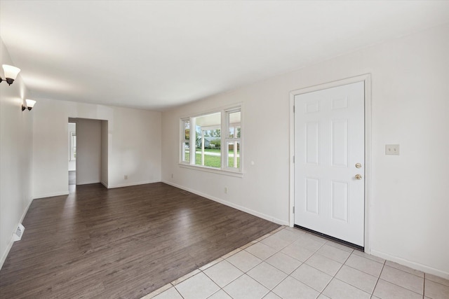 spare room featuring light hardwood / wood-style flooring